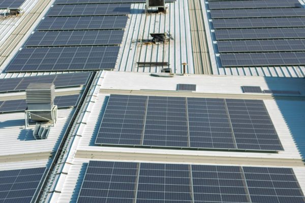 Aerial view of solar panels on an urban rooftop in Valle del Cauca, Colombia.