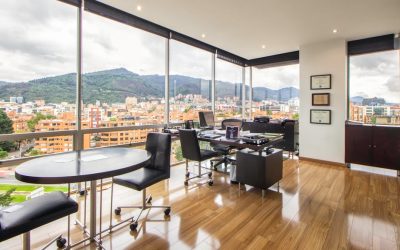 pexels-photo-7377687-7377687 Spacious modern office with a scenic city view through glass windows.